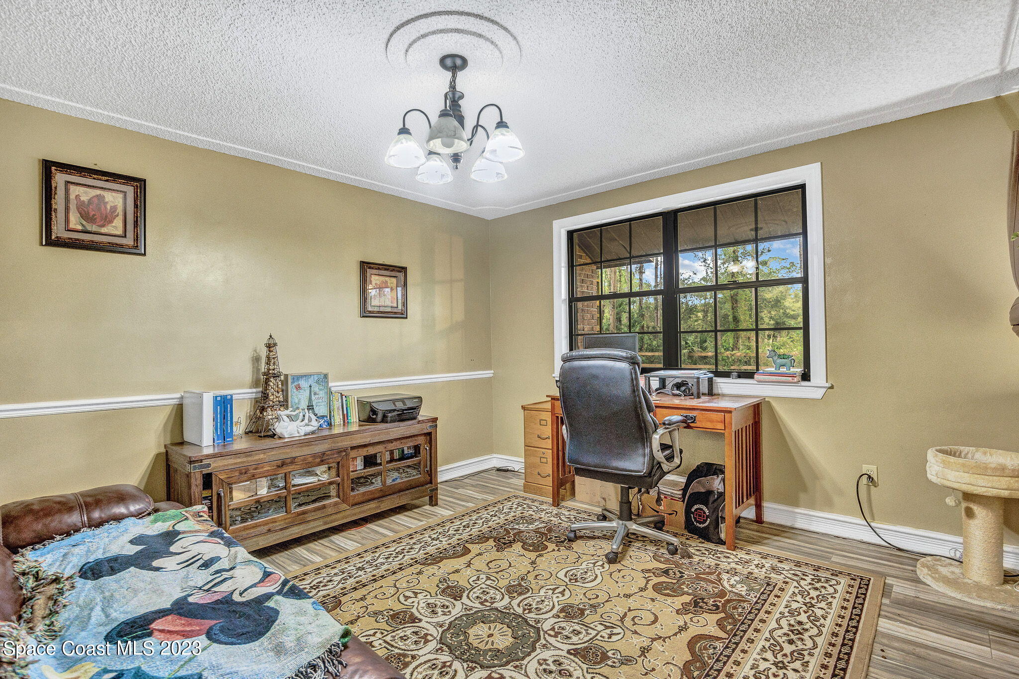 2281 Friday Road Cocoa, FL 32926 - Photo 20 of 72 a bedroom with furniture and a window