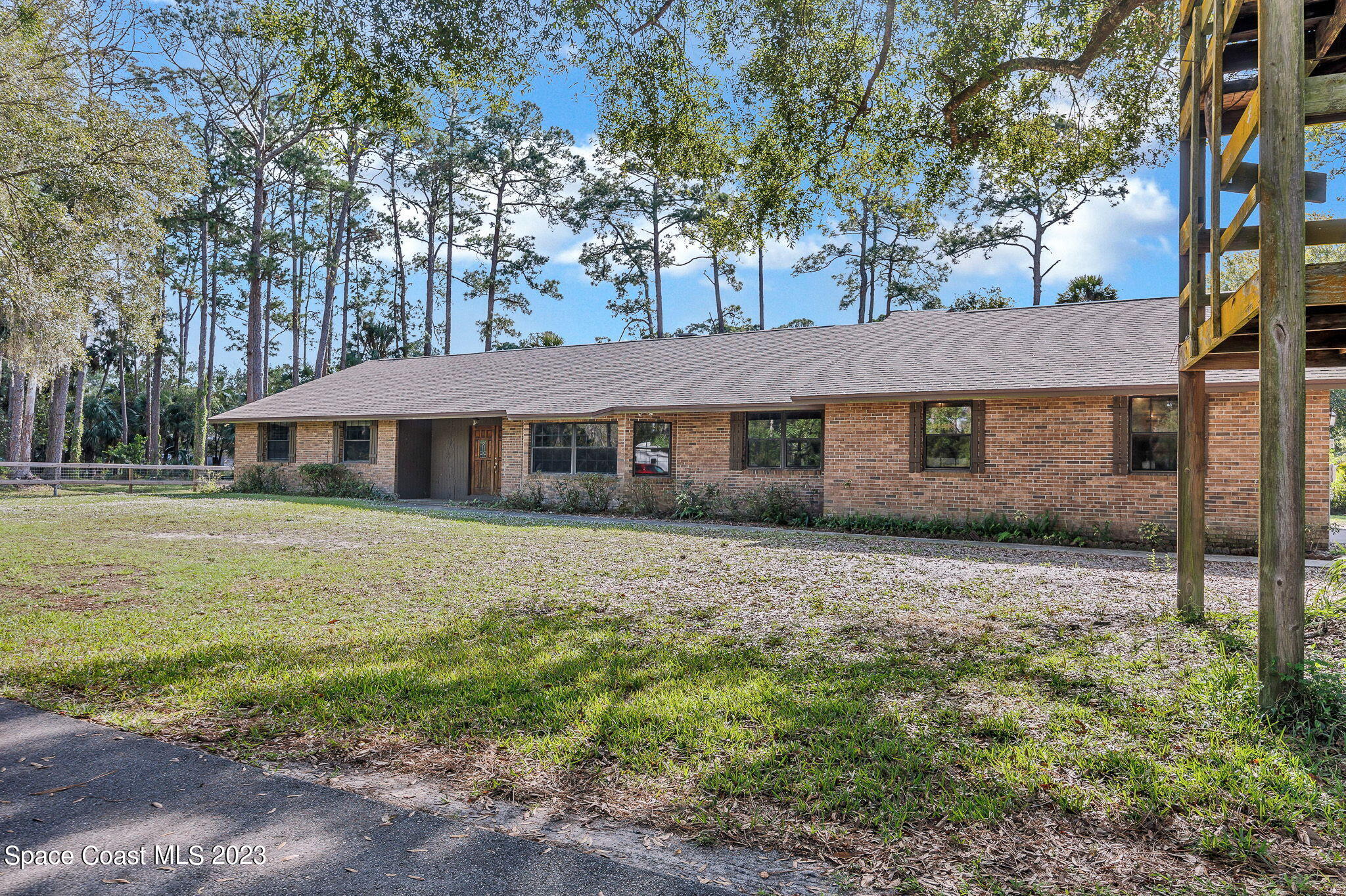 2281 Friday Road Cocoa, FL 32926 - Photo 2 of 72 a front view of a house with a garden