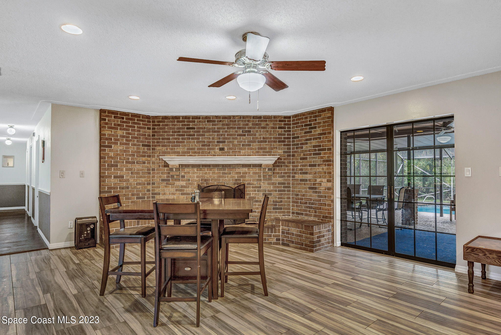 2281 Friday Road Cocoa, FL 32926 - Photo 22 of 72 a view of a dining room with furniture window and wooden floor