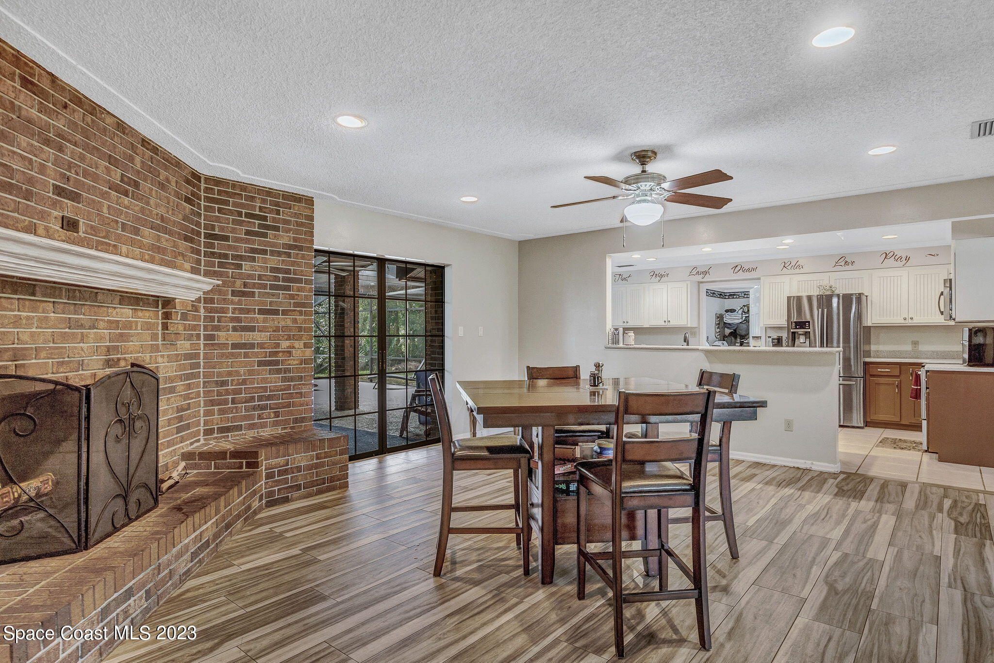 2281 Friday Road Cocoa, FL 32926 - Photo 23 of 72 a view of a dining room with furniture and wooden floor