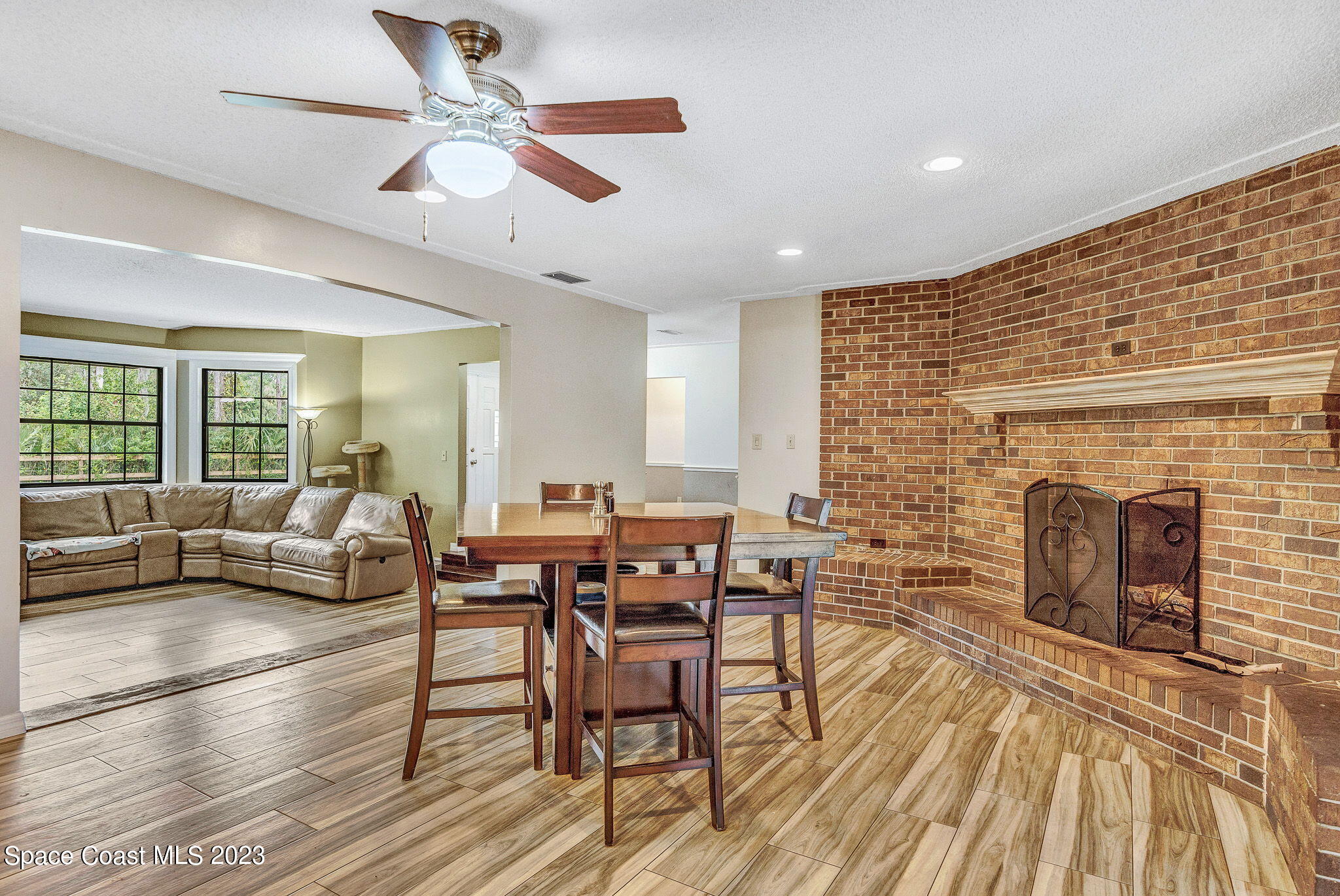 2281 Friday Road Cocoa, FL 32926 - Photo 24 of 72 a living room with furniture and a fireplace