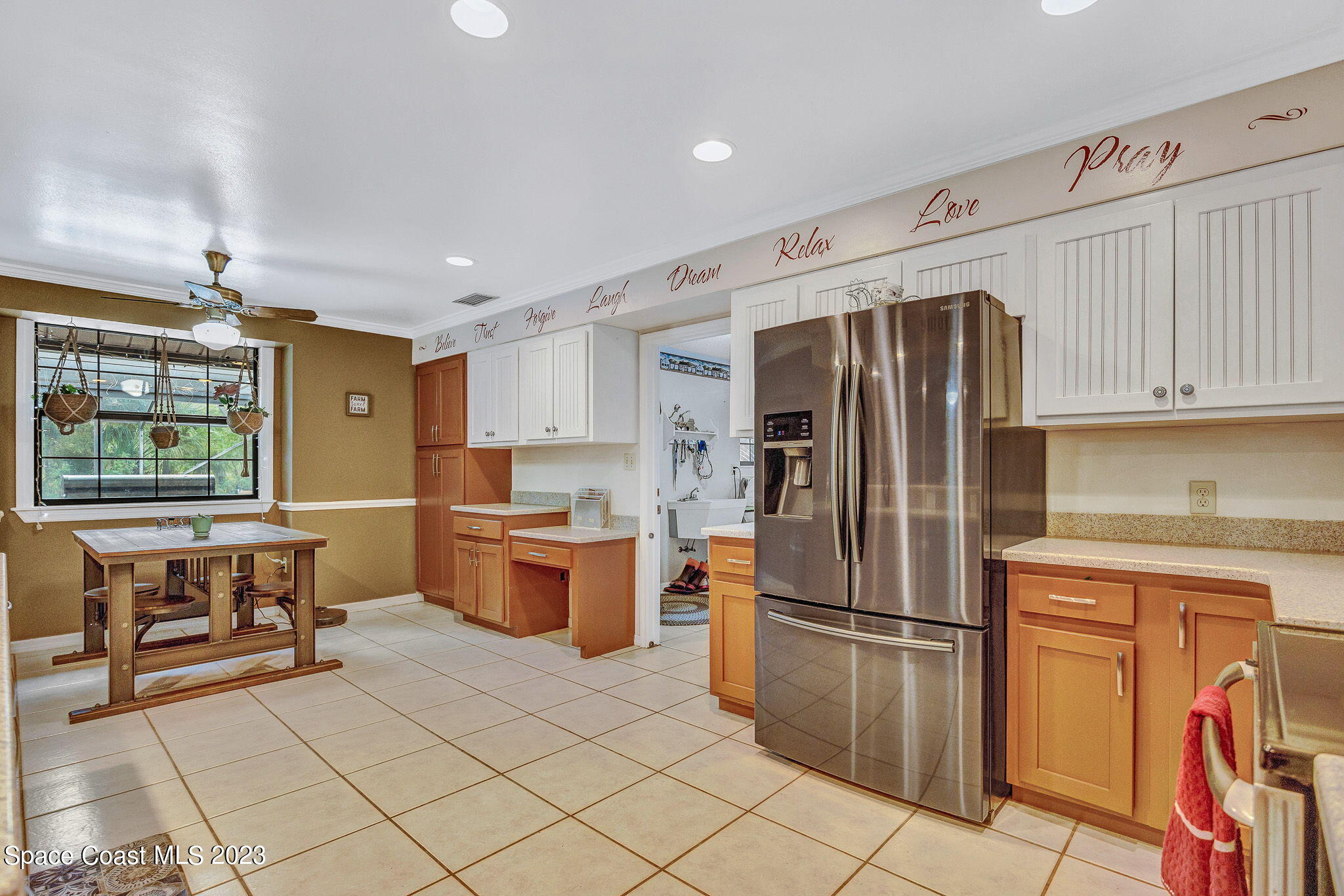 2281 Friday Road Cocoa, FL 32926 - Photo 25 of 72 a kitchen with stainless steel appliances granite countertop a refrigerator and a stove top oven
