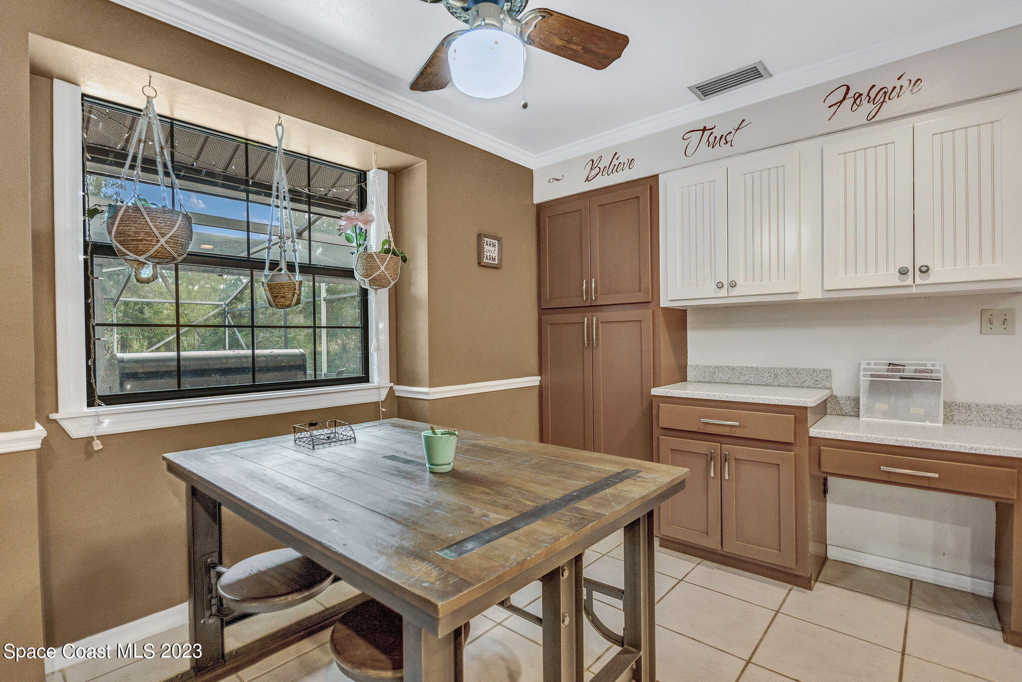 2281 Friday Road Cocoa, FL 32926 - Photo 29 of 72 a kitchen with appliances cabinets and wooden floor