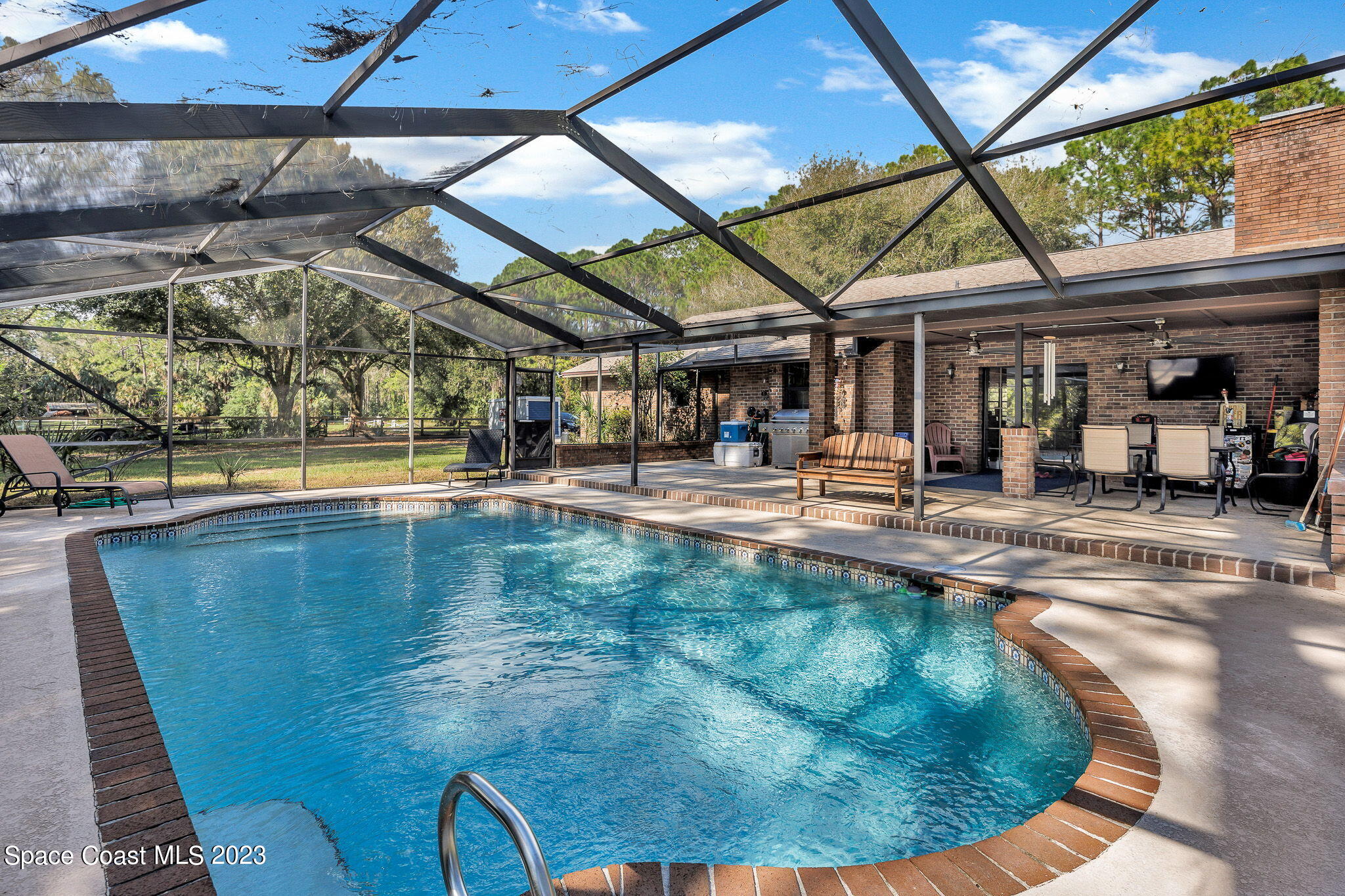 2281 Friday Road Cocoa, FL 32926 - Photo 37 of 72 a view of a swimming pool with a patio