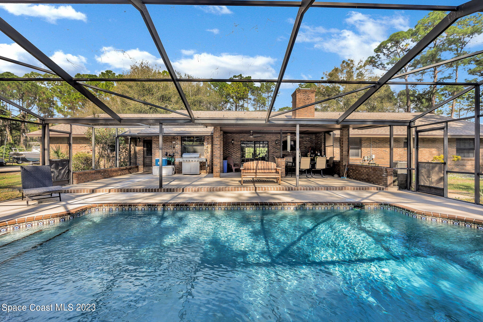 2281 Friday Road Cocoa, FL 32926 - Photo 38 of 72 a view of a swimming pool with a patio