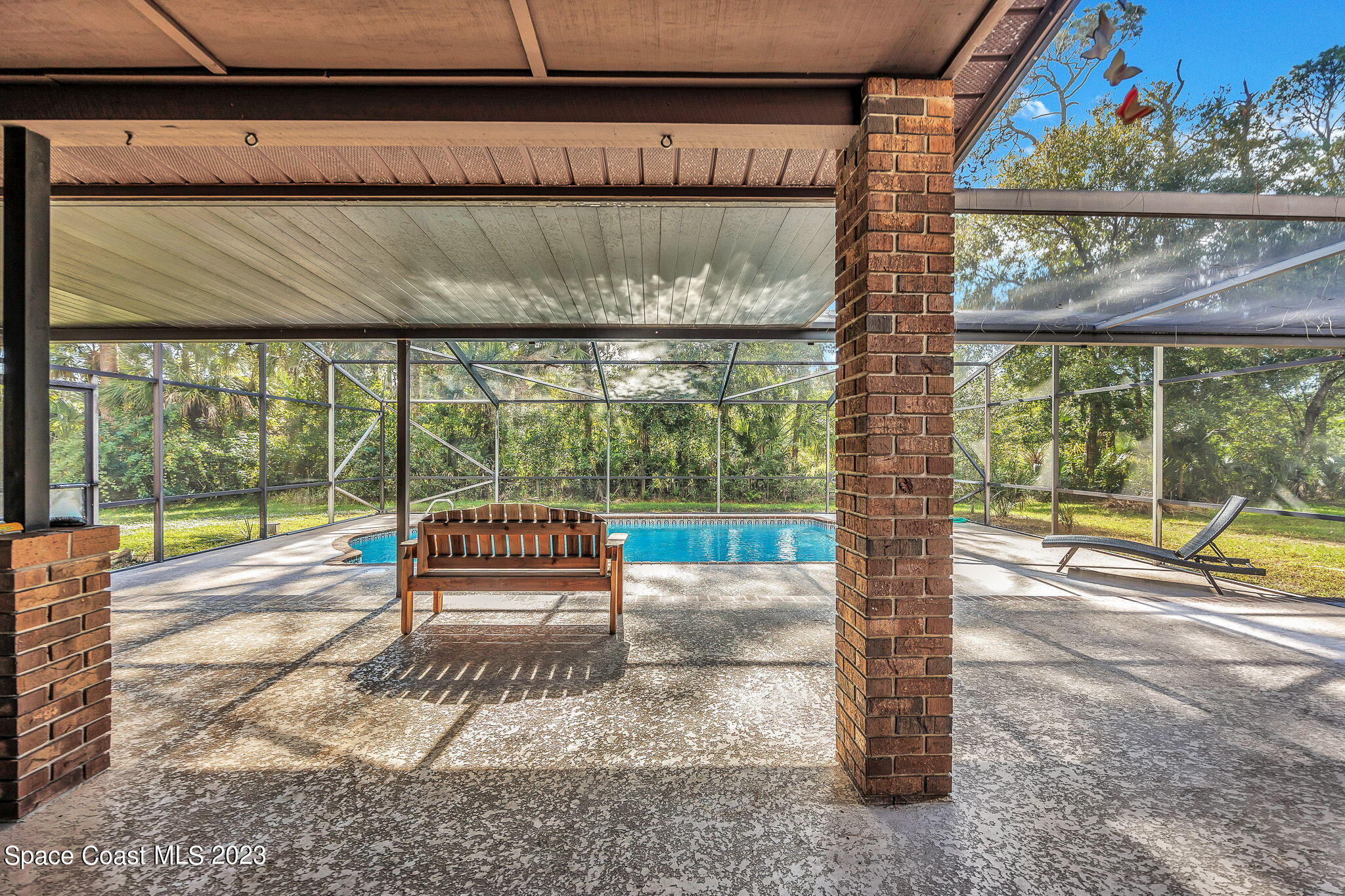 2281 Friday Road Cocoa, FL 32926 - Photo 41 of 72 a sitting area with swimming pool in front of it