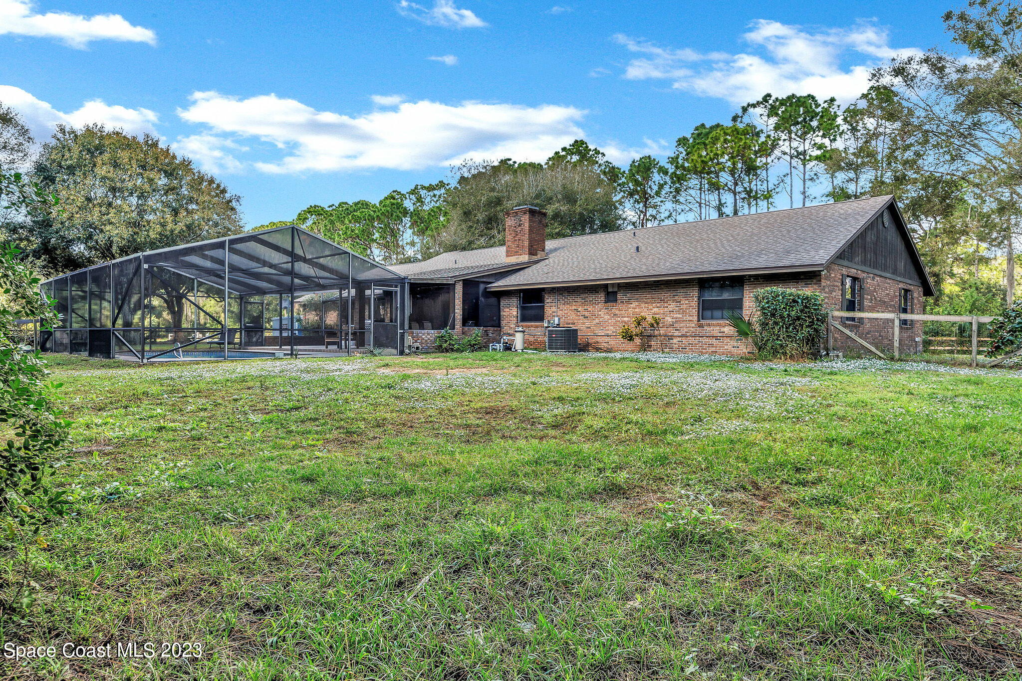 2281 Friday Road Cocoa, FL 32926 - Photo 45 of 72 a house view with swimming pool and garden space