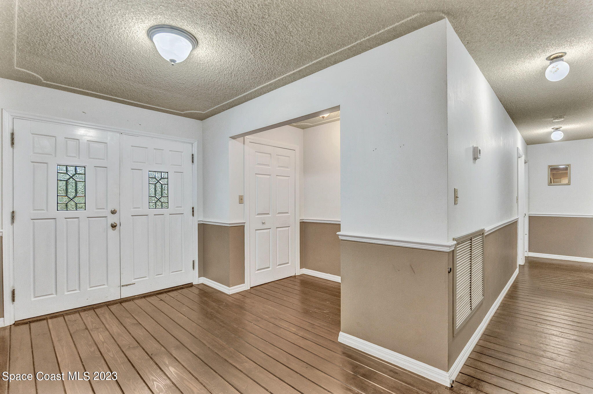 2281 Friday Road Cocoa, FL 32926 - Photo 5 of 72 wooden floor in an empty room with a window