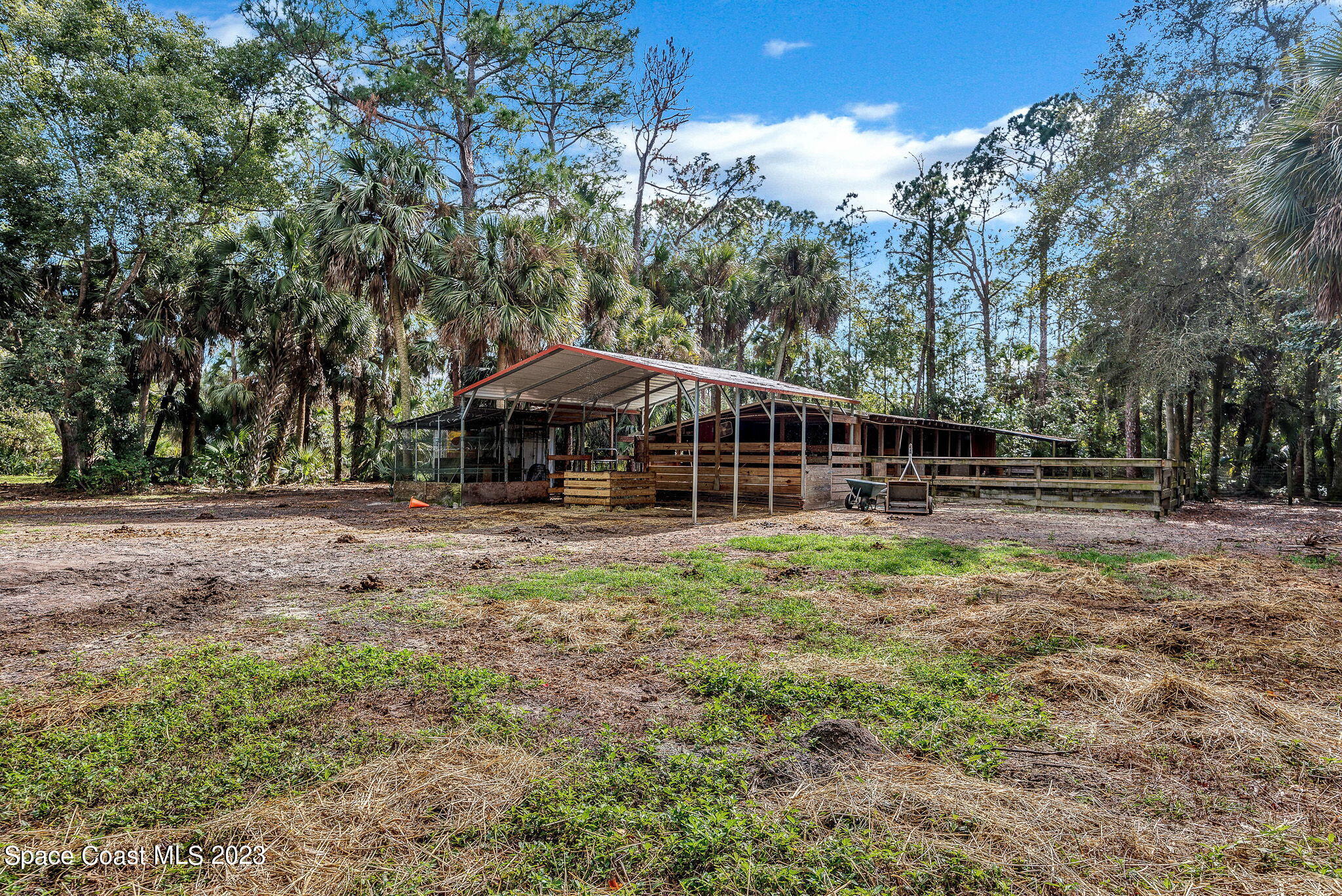2281 Friday Road Cocoa, FL 32926 - Photo 55 of 72 a backyard of a house with lots of green space and fountain