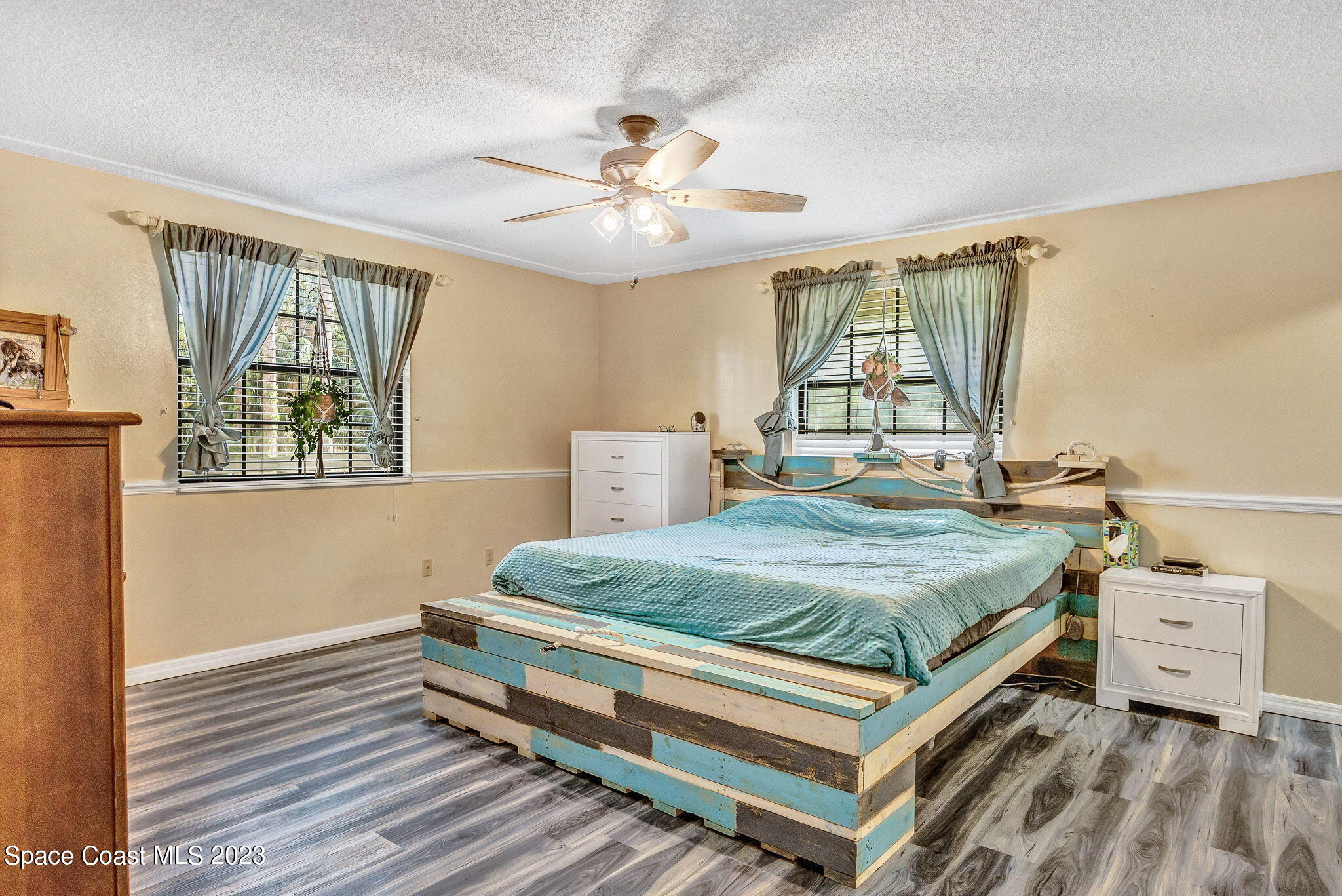 2281 Friday Road Cocoa, FL 32926 - Photo 6 of 72 a bedroom with a bed and wooden floor