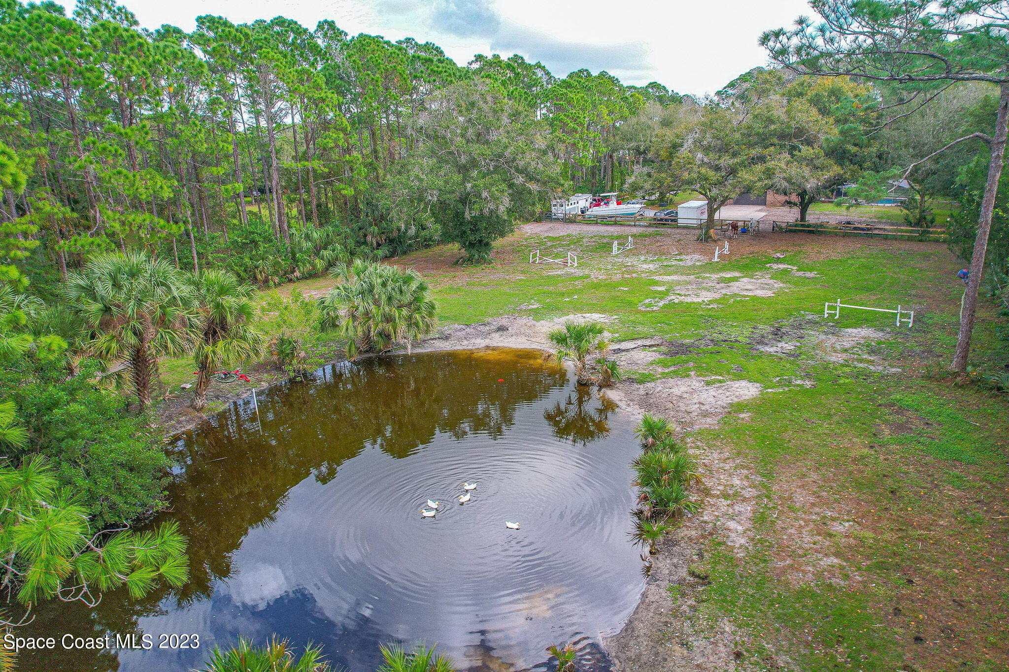 2281 Friday Road Cocoa, FL 32926 - Photo 69 of 72 a aerial view of a house with a yard and lake view