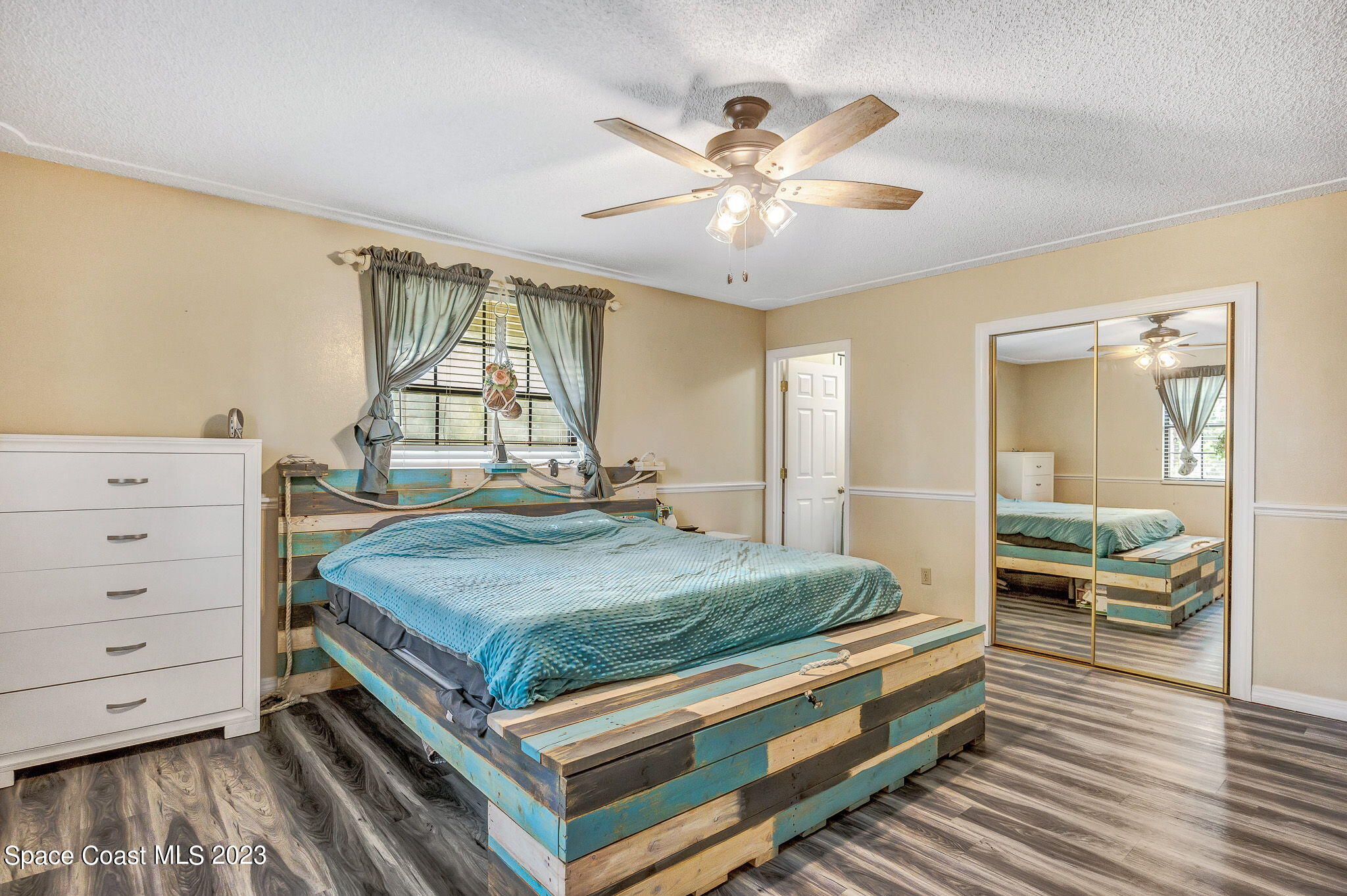 2281 Friday Road Cocoa, FL 32926 - Photo 7 of 72 a bed sitting in a spacious bedroom next to a window