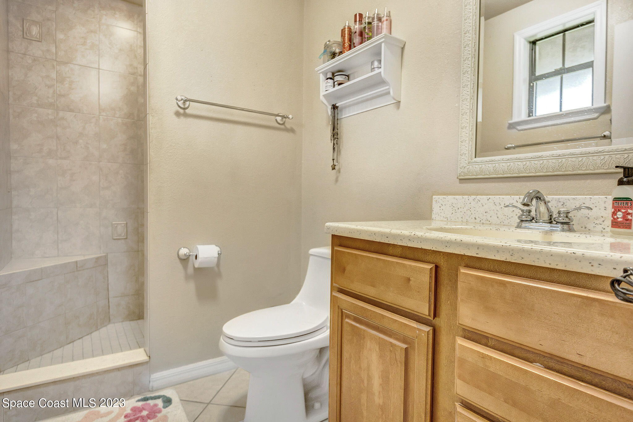 2281 Friday Road Cocoa, FL 32926 - Photo 9 of 72 a bathroom with a granite countertop sink toilet and shower