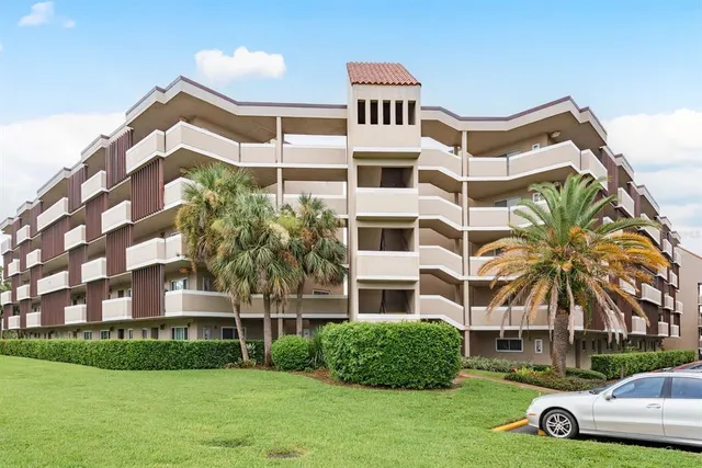 a front view of a building with garden