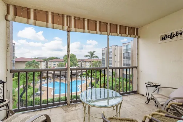 a view of a balcony with furniture