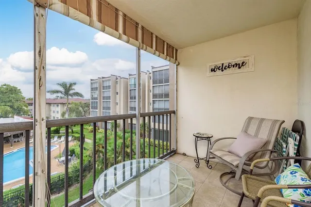 a view of a balcony with furniture