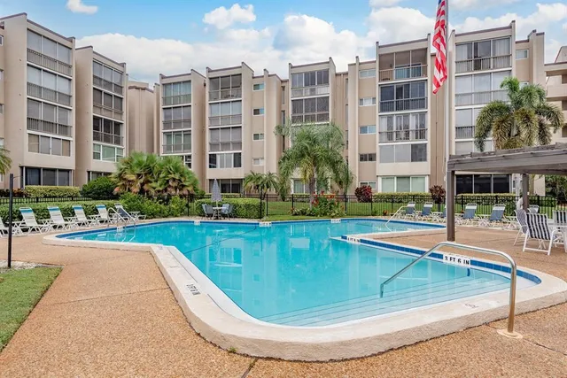 a view of a swimming pool with a lounge chairs
