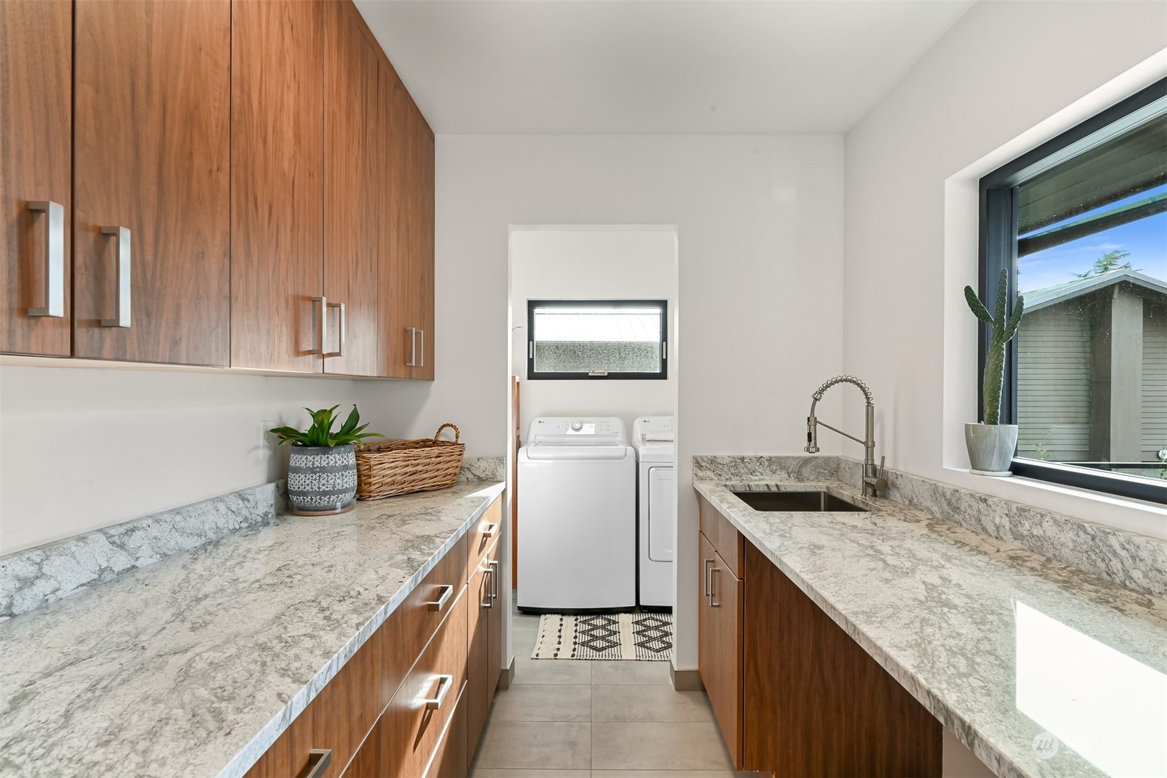426 Bayside Road Bellingham, WA 98225 - Photo 16 of 42 a kitchen with granite countertop a sink a stove and cabinets