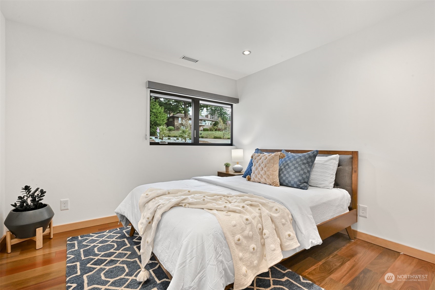 426 Bayside Road Bellingham, WA 98225 - Photo 21 of 42 a large bed sitting in a bedroom next to a window