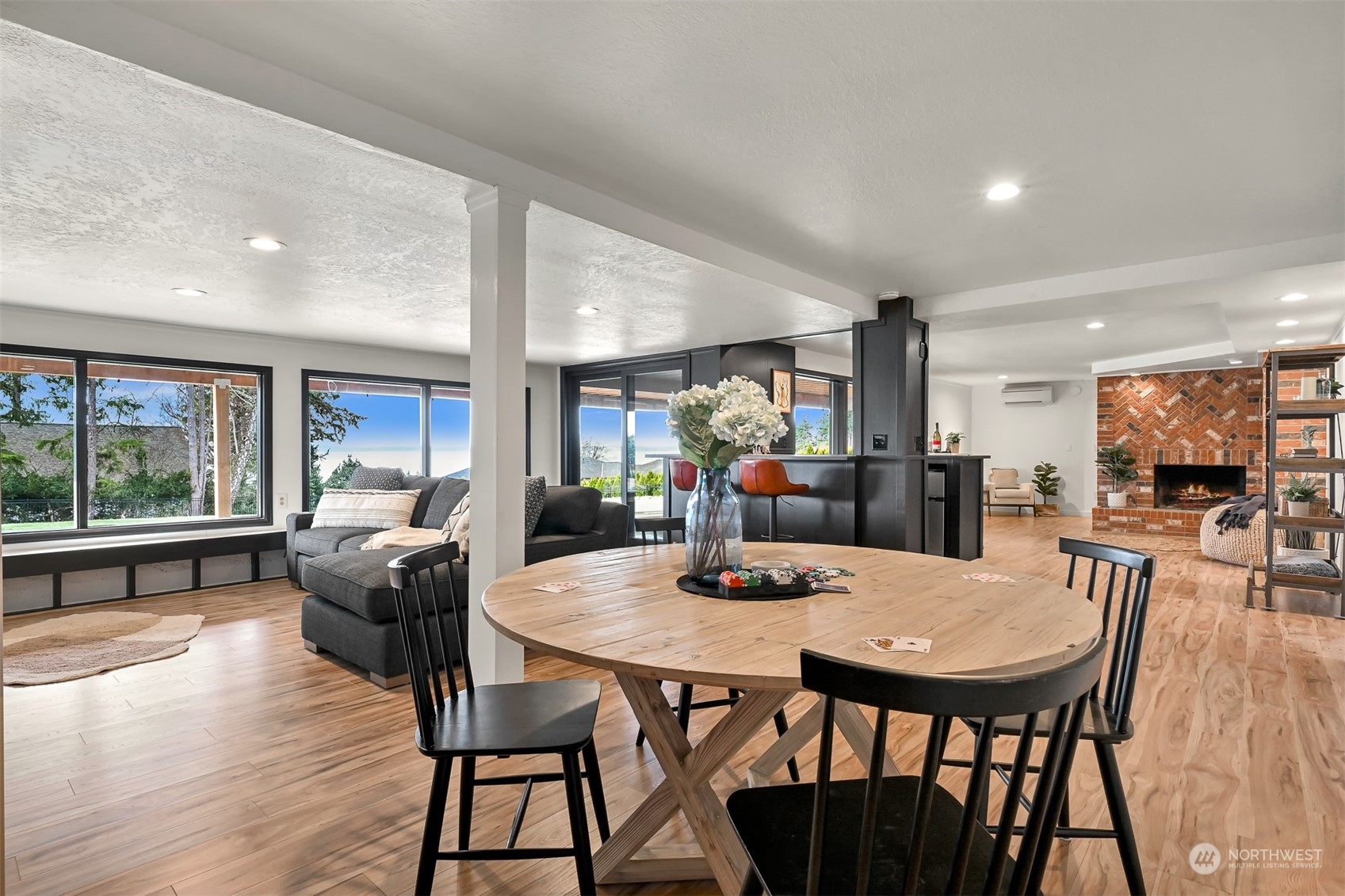 426 Bayside Road Bellingham, WA 98225 - Photo 24 of 42 a view of a dining room with furniture window and wooden floor