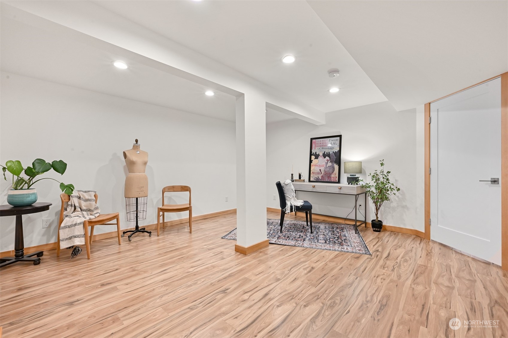 426 Bayside Road Bellingham, WA 98225 - Photo 25 of 42 a living room with furniture and a wooden floor