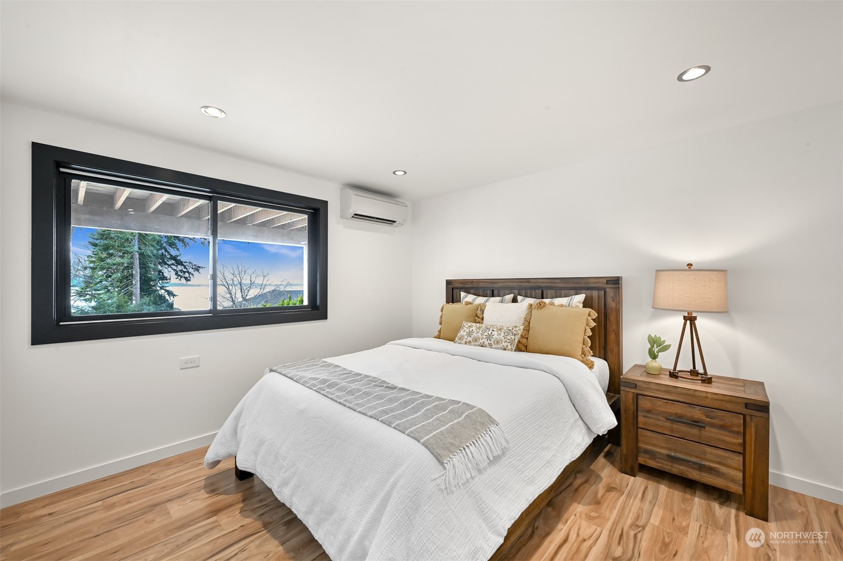 426 Bayside Road Bellingham, WA 98225 - Photo 26 of 42 a bedroom with a bed and a painting on the wall