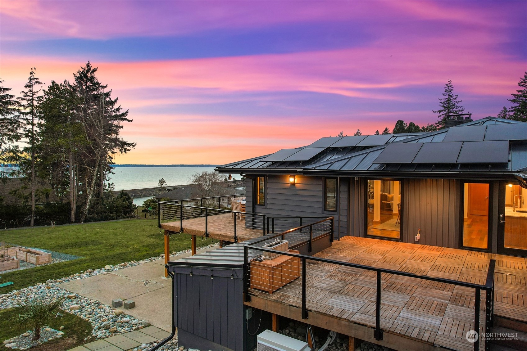 426 Bayside Road Bellingham, WA 98225 - Photo 34 of 42 a view of a patio with a table and chairs