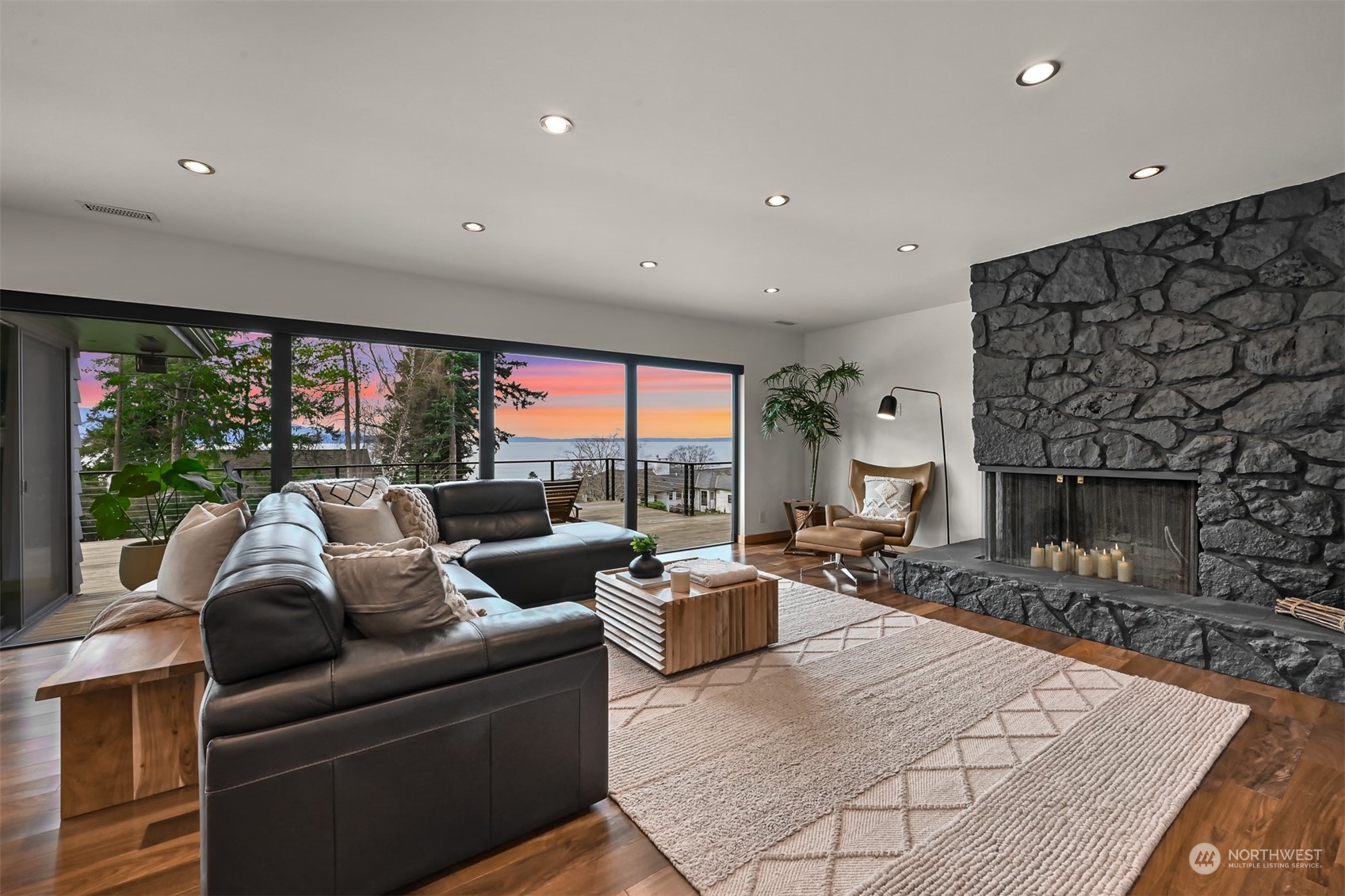 426 Bayside Road Bellingham, WA 98225 - Photo 37 of 42 a living room with furniture a fireplace and large windows