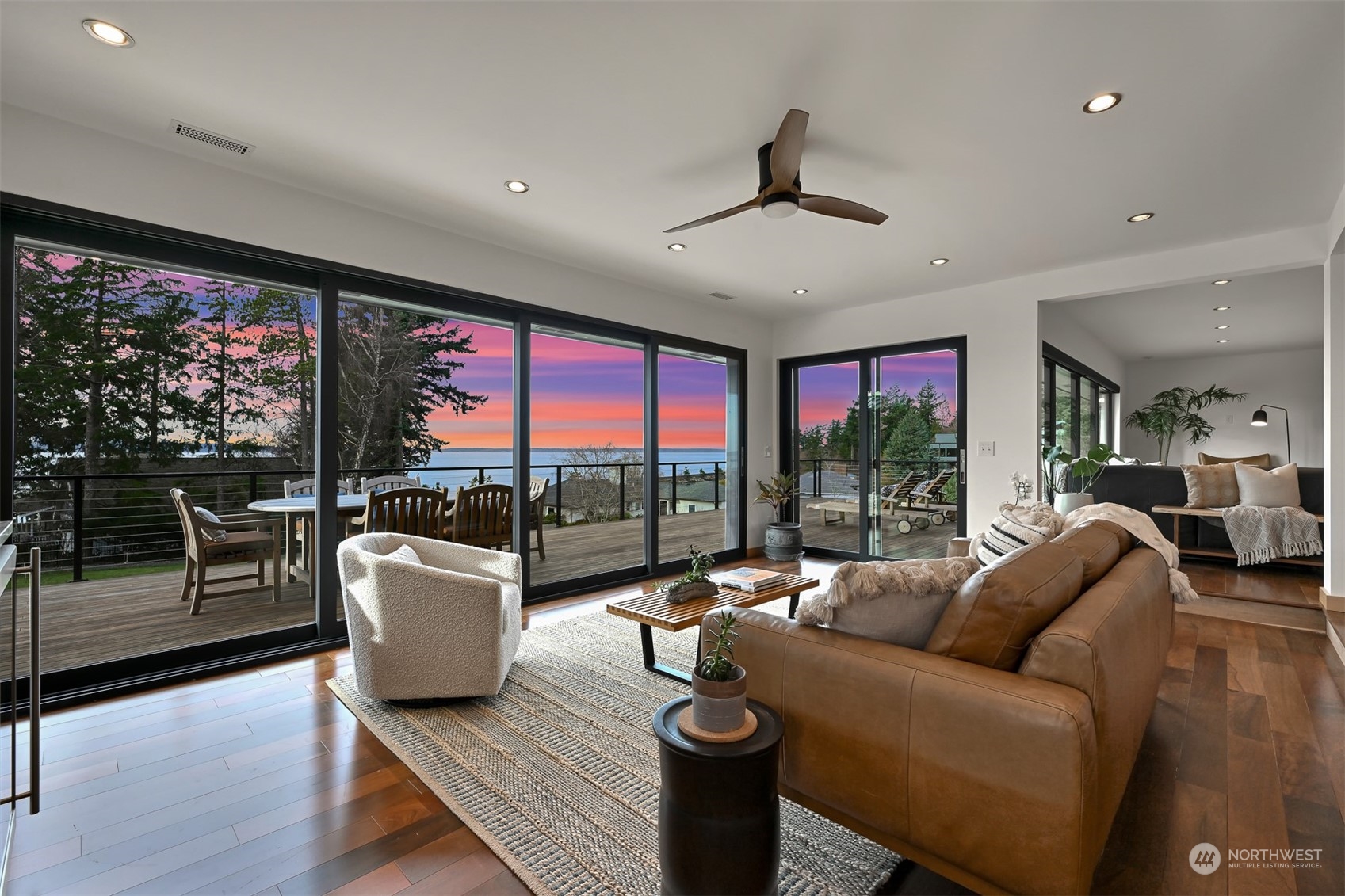 426 Bayside Road Bellingham, WA 98225 - Photo 38 of 42 a living room with furniture and a floor to ceiling window