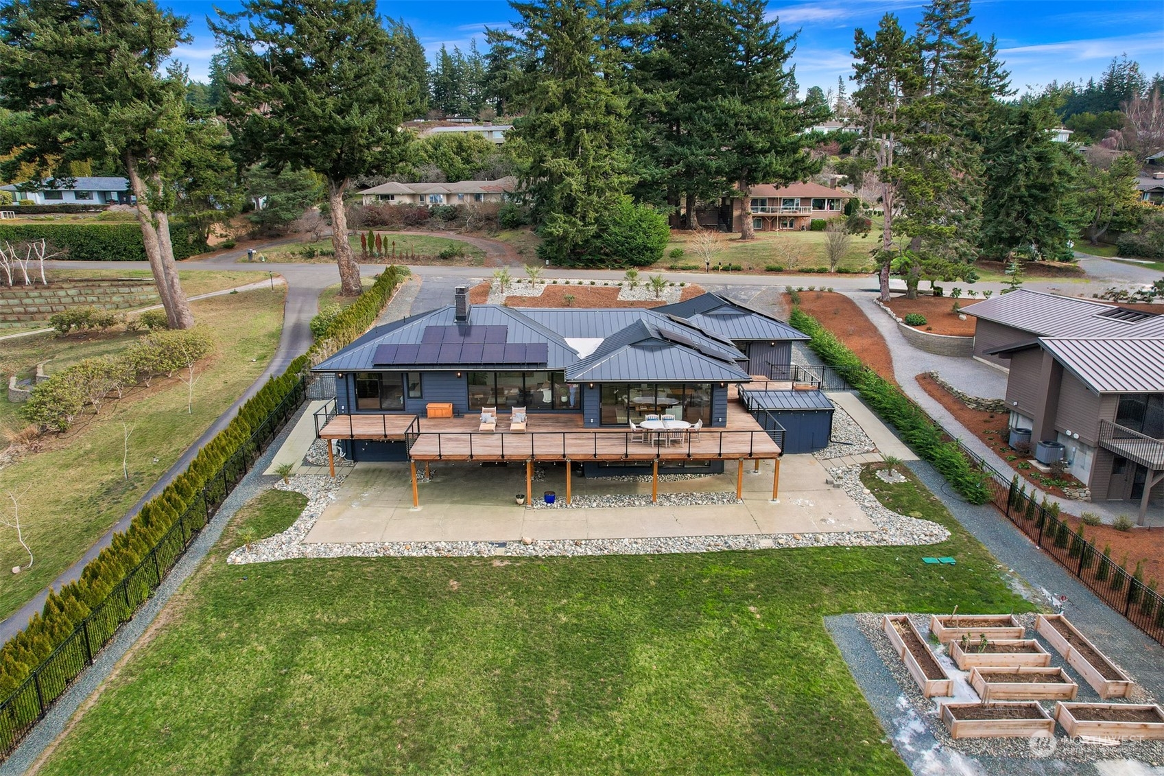 426 Bayside Road Bellingham, WA 98225 - Photo 4 of 42 a view of a house with pool and chairs