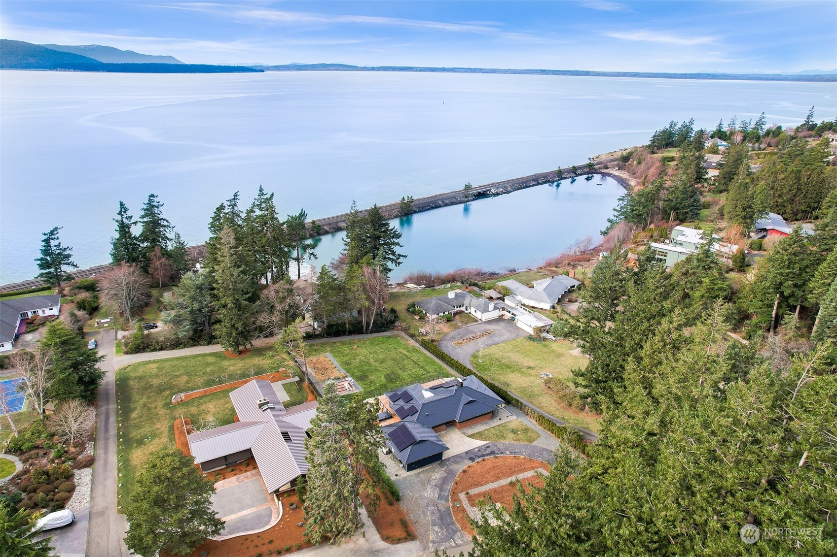 426 Bayside Road Bellingham, WA 98225 - Photo 5 of 42 an aerial view of a house with a yard and lake view