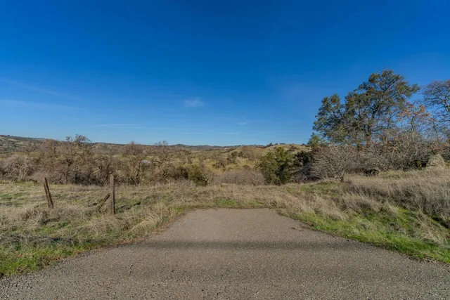 a view of a road with a mountain in the background