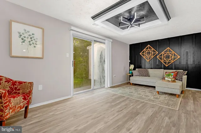 a view of a livingroom with furniture and window