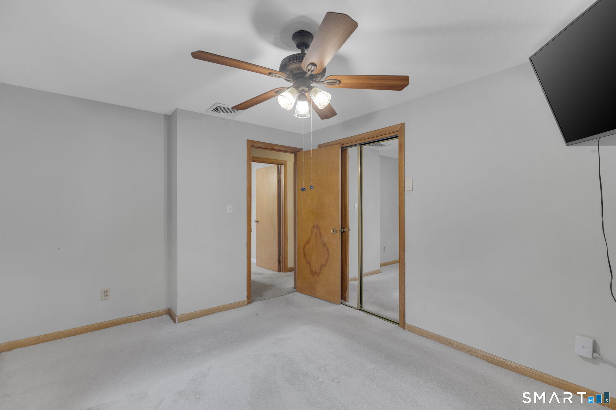 102 Wayne Lane Meriden, CT 06450 - Photo 17 of 36 a view of an empty room with a ceiling fan