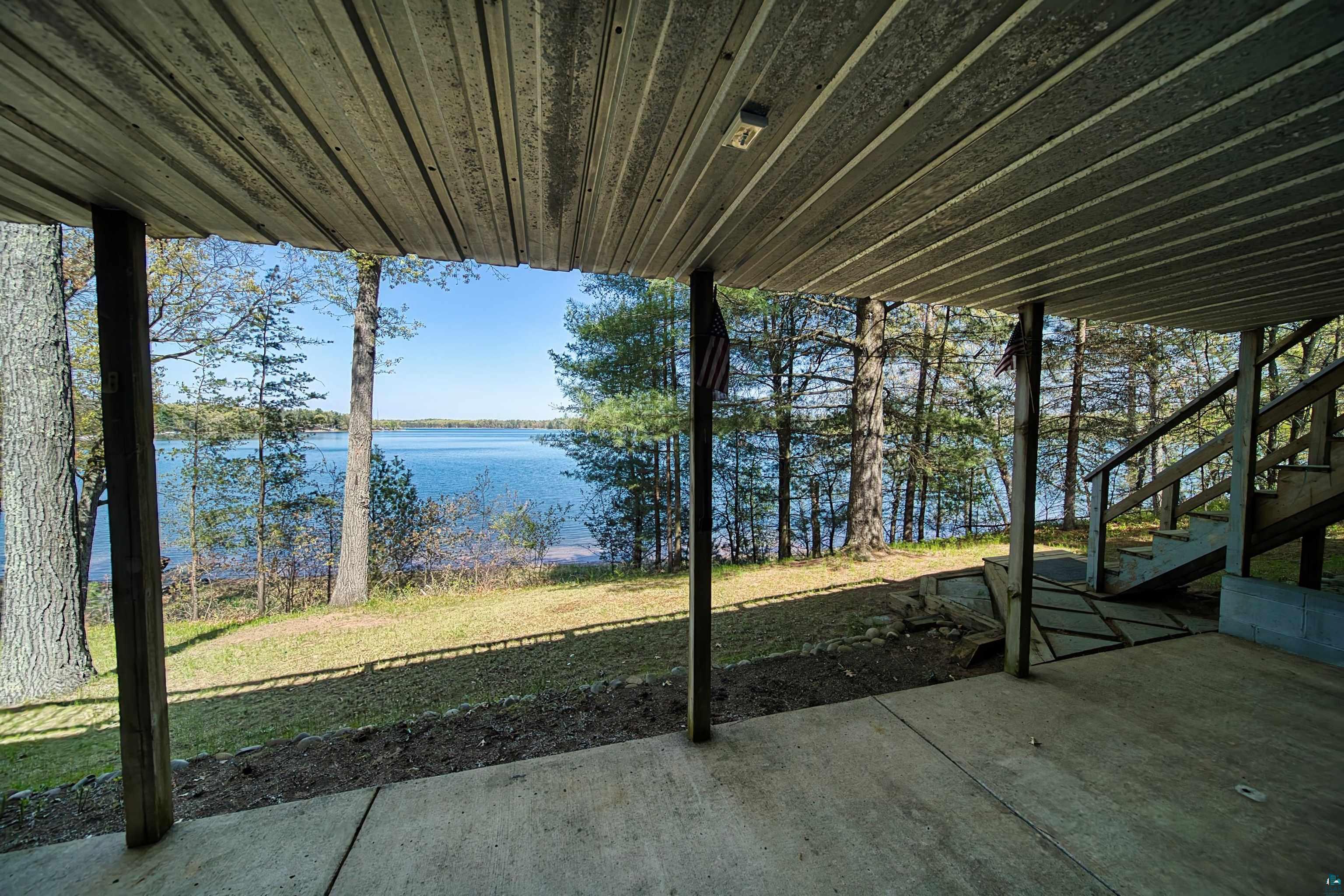 29836 Long Lake Road Danbury, WI 54830 - Photo 25 of 40 View of patio / terrace featuring a water view