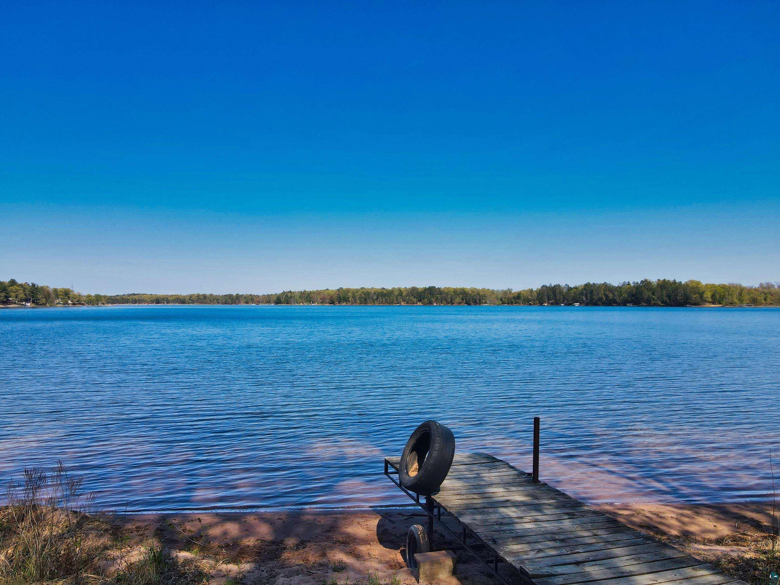 Property view of water featuring a dock