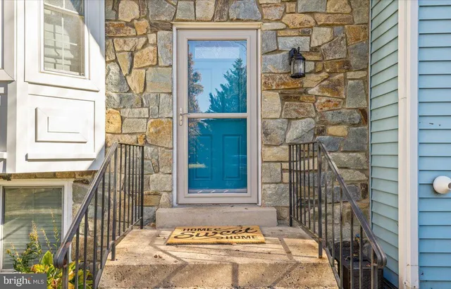 a front view of a house with a glass door