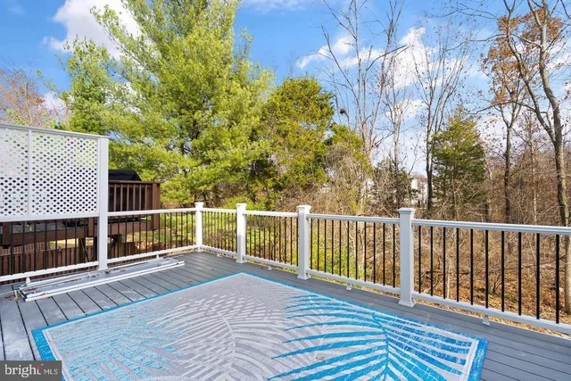 a balcony with view of tree