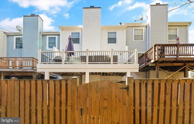 a view of a house with wooden deck