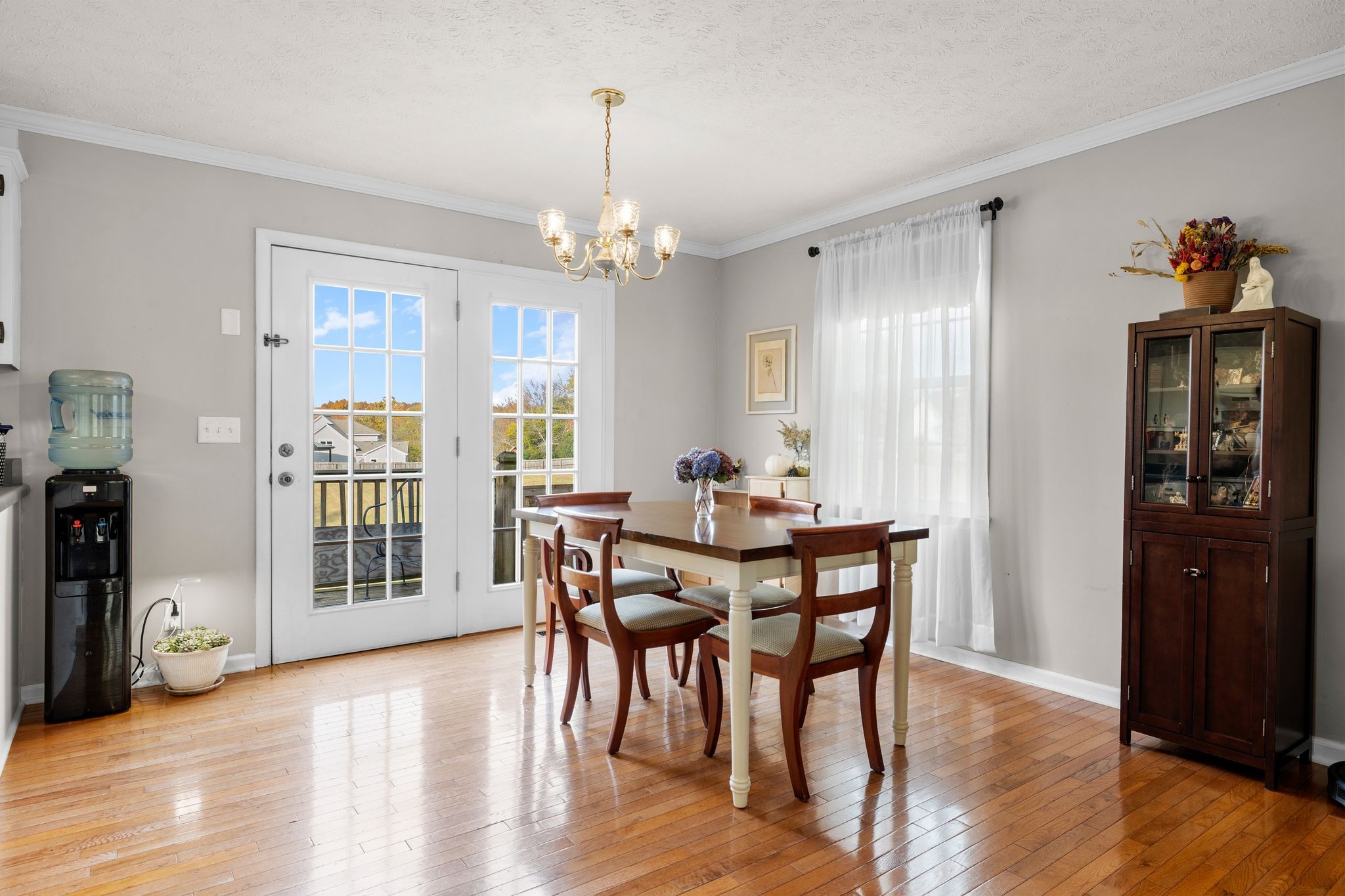 7514 Cox Pike Fairview, TN 37062 - Photo 11 of 37 a view of a dining room with furniture window and wooden floor