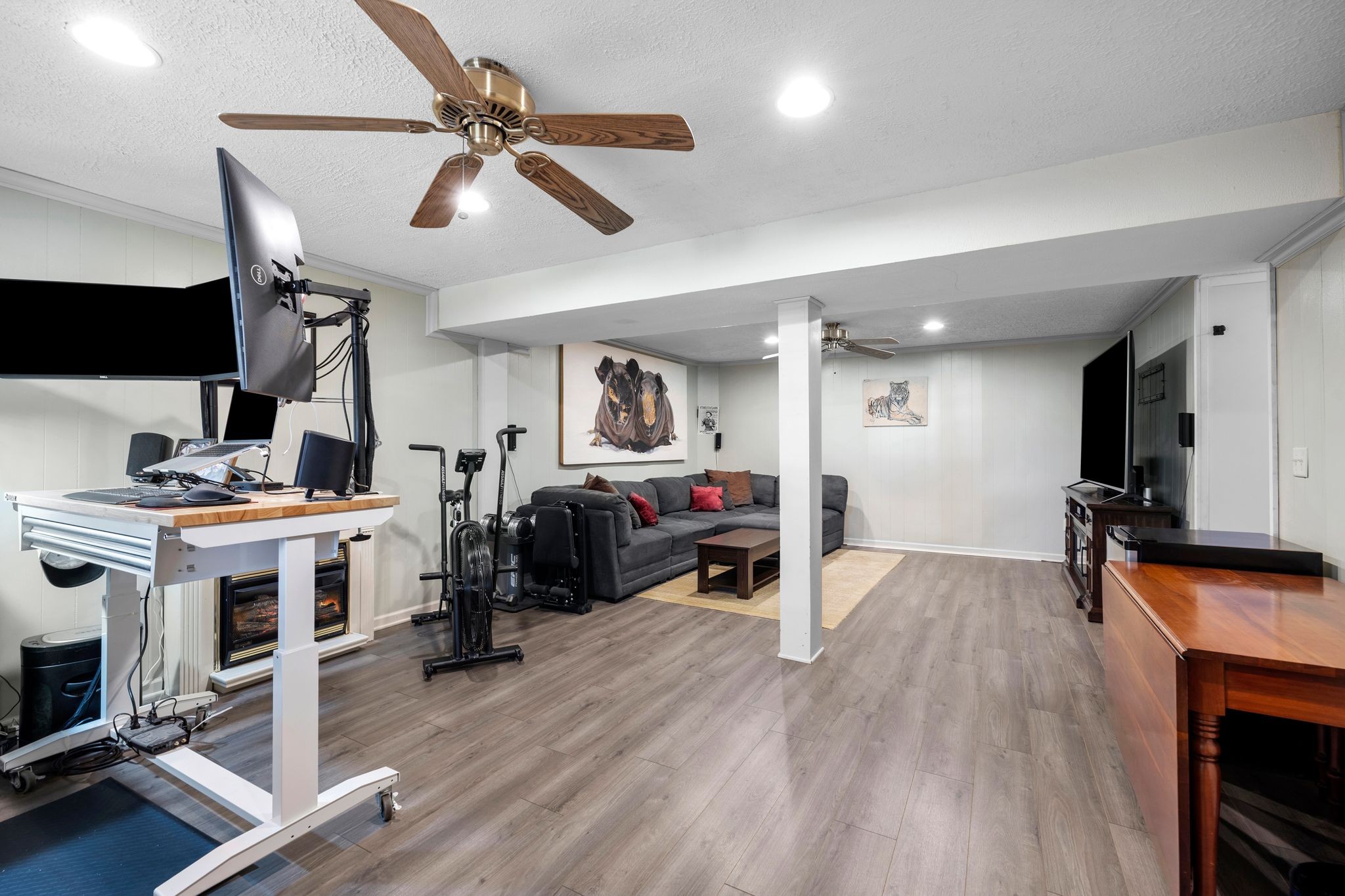 7514 Cox Pike Fairview, TN 37062 - Photo 19 of 37 a view of a livingroom with furniture a flat screen tv and a ceiling fan
