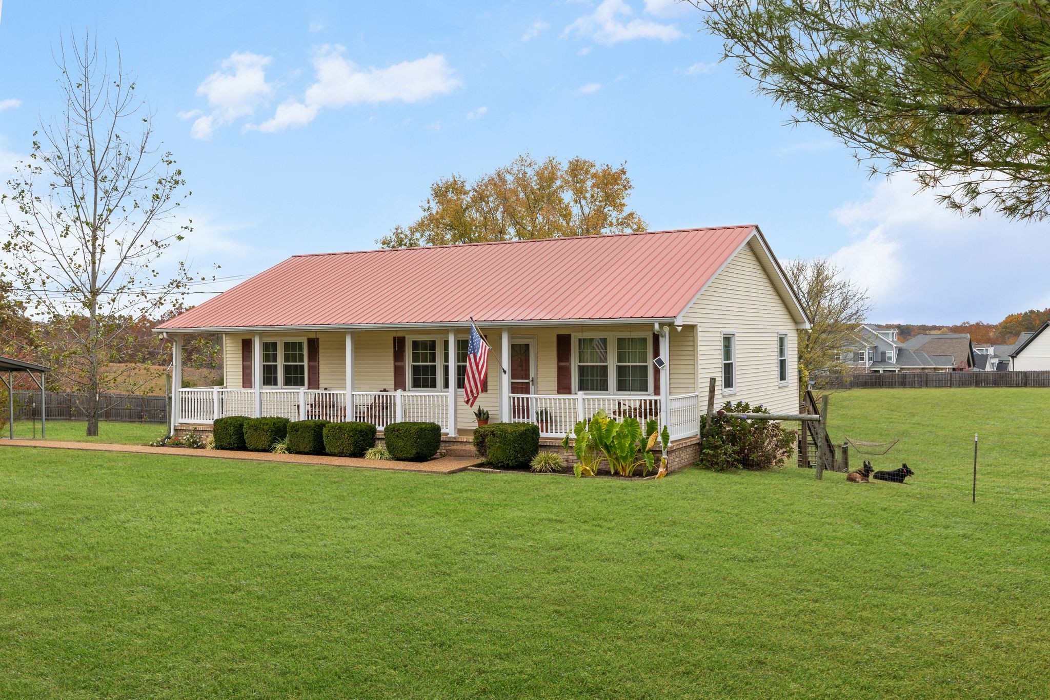 7514 Cox Pike Fairview, TN 37062 - Photo 2 of 37 a front view of a house with garden