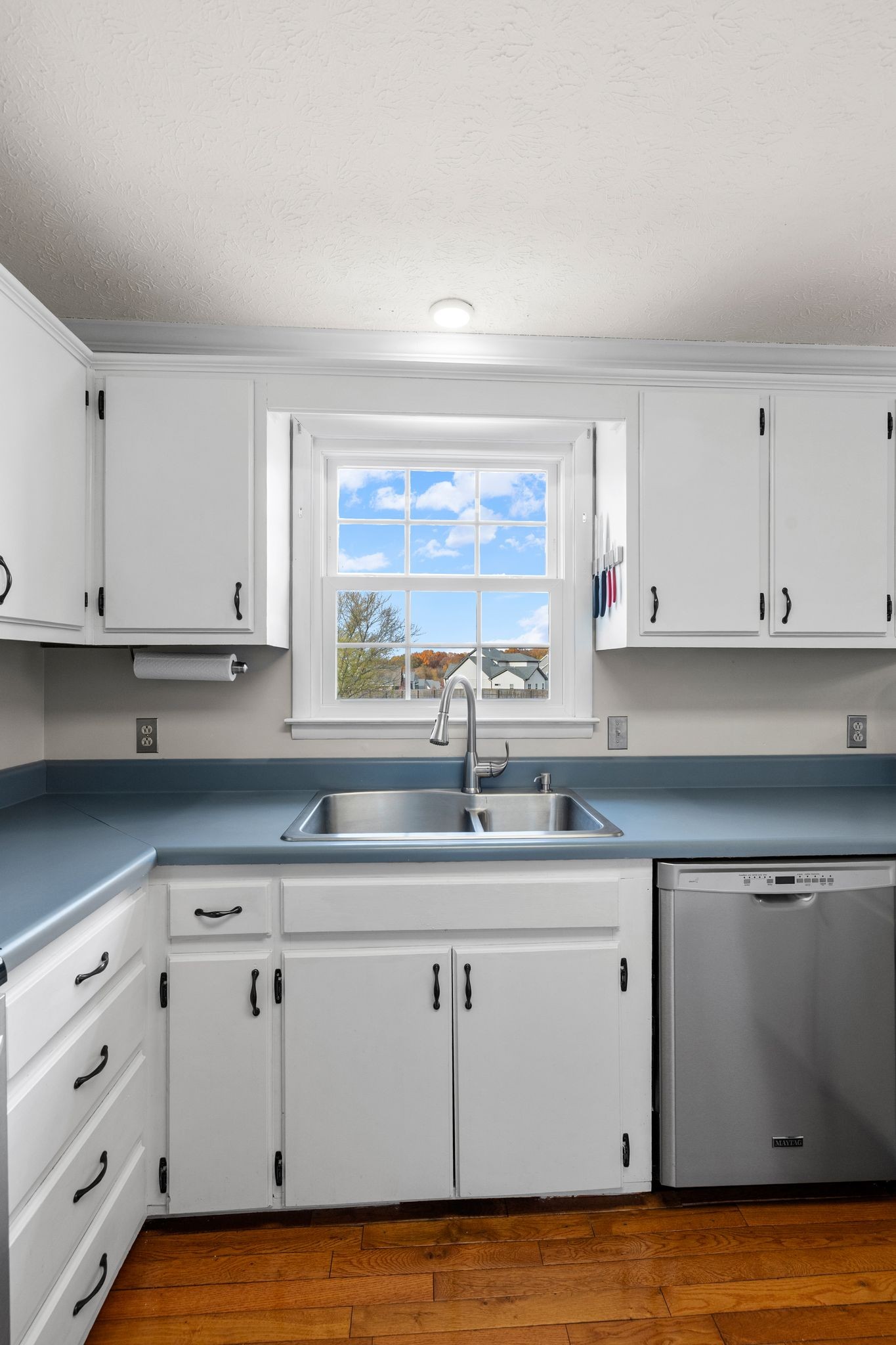 7514 Cox Pike Fairview, TN 37062 - Photo 9 of 37 a kitchen with white cabinets and a sink