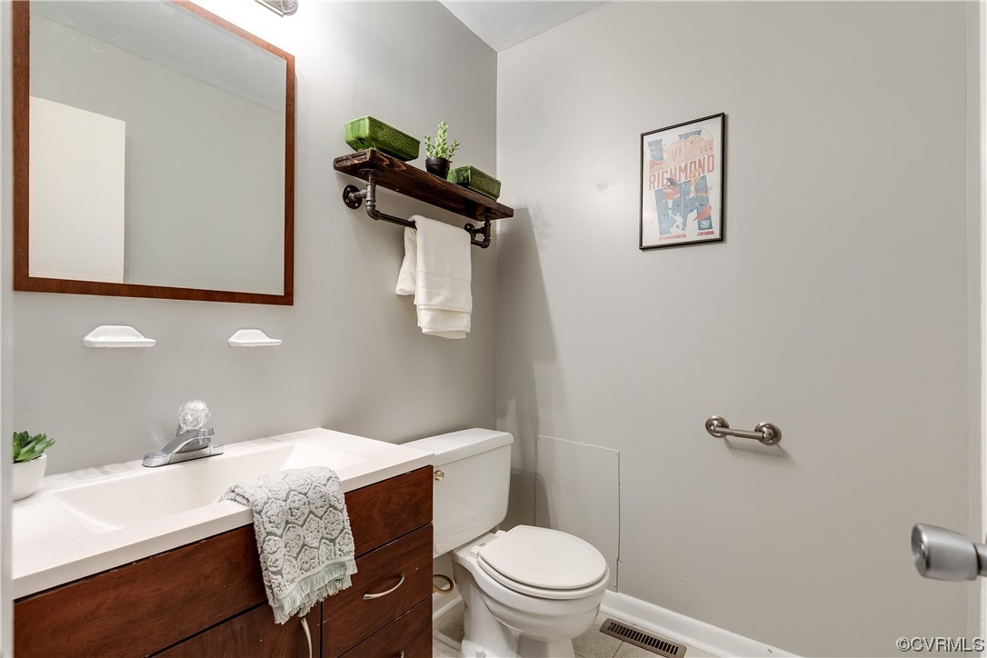 213 Monath Road Chesterfield, VA 23236 - Photo 18 of 38 a bathroom with a granite countertop toilet sink and mirror