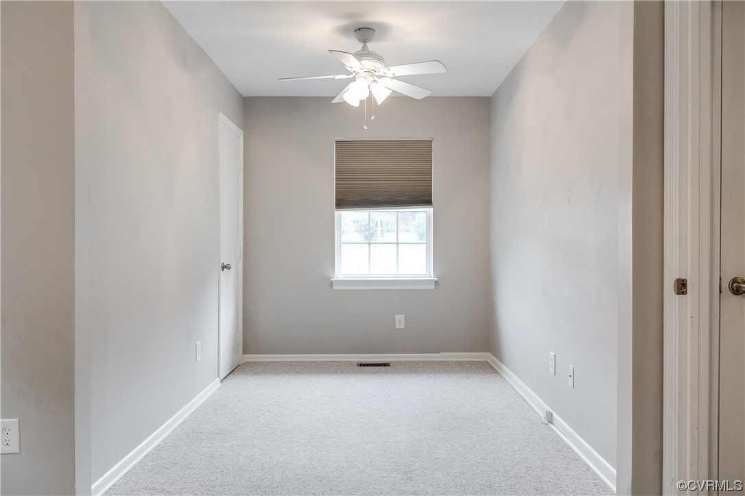 213 Monath Road Chesterfield, VA 23236 - Photo 21 of 38 an empty room with a window and a ceiling fan