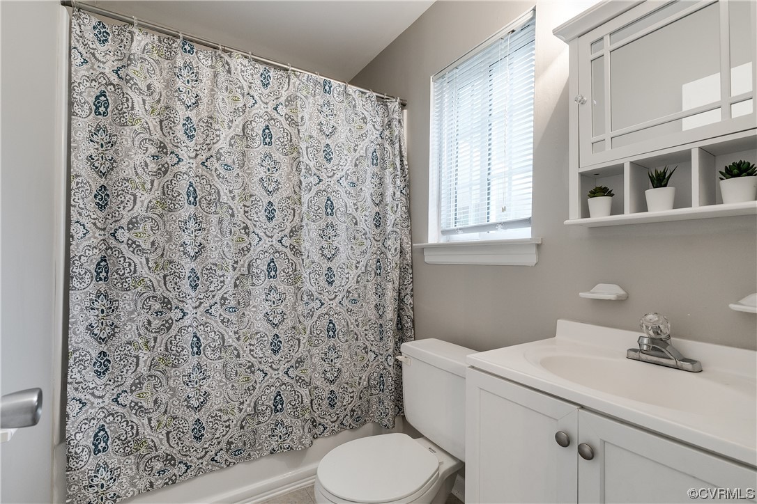 213 Monath Road Chesterfield, VA 23236 - Photo 22 of 38 a white toilet sitting next to a bathroom sink