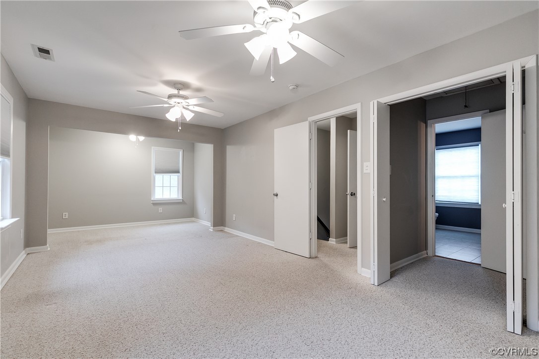 213 Monath Road Chesterfield, VA 23236 - Photo 24 of 38 an empty room with chandelier fan and windows