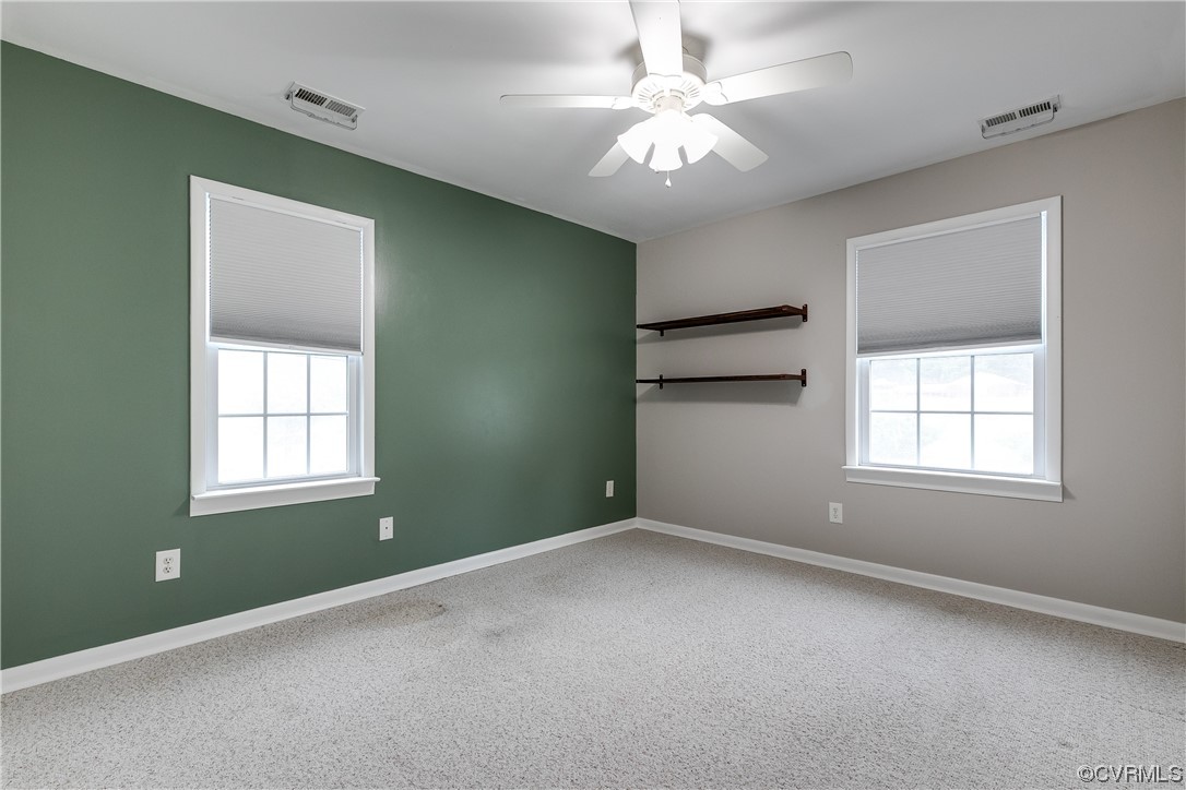 213 Monath Road Chesterfield, VA 23236 - Photo 31 of 38 an empty room with windows and fan
