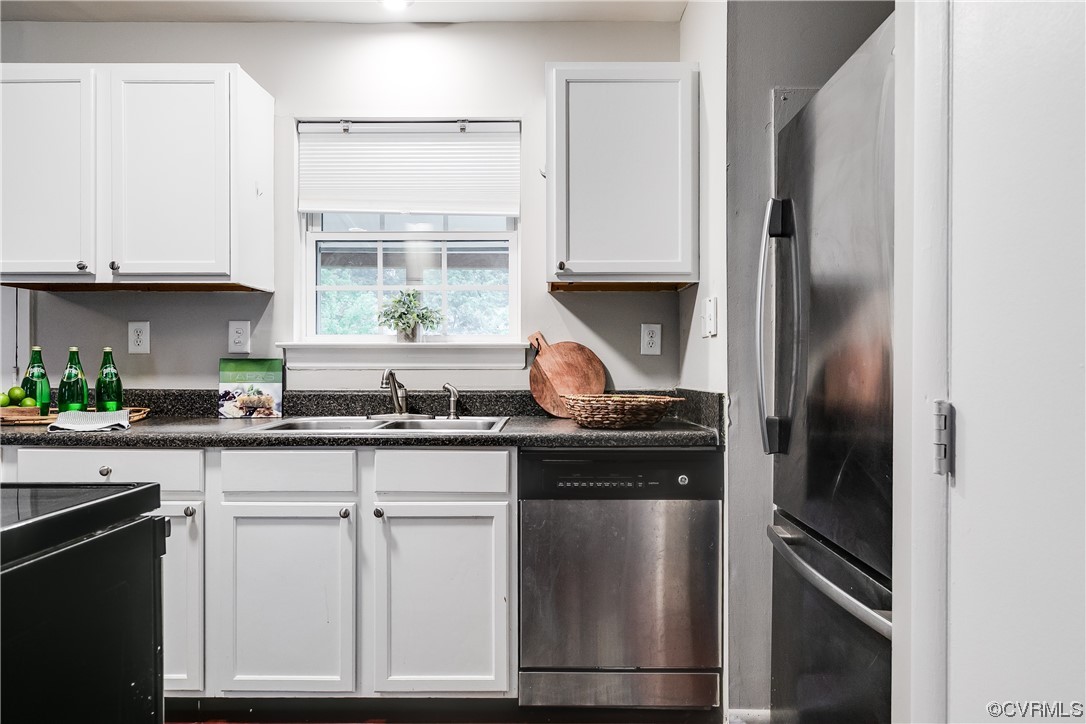 213 Monath Road Chesterfield, VA 23236 - Photo 10 of 38 a kitchen with white cabinets and a stove