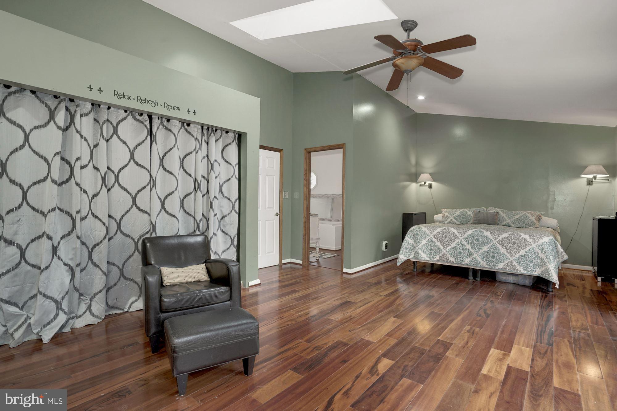 6823 Old Solomons Island Road Friendship, MD 20758 - Photo 29 of 41 Primary Bedroom with deck and ensuite bath